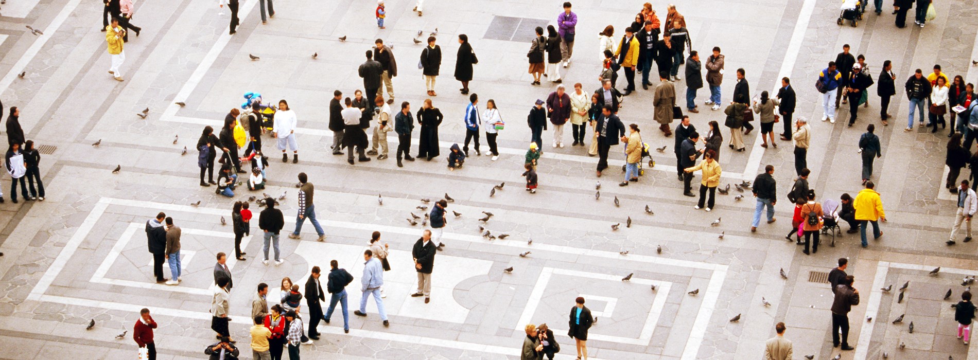 Elevated view of people walking in a square
